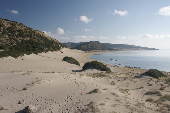Beaches in Cyprus: golden beach with sand dunes, empty.
