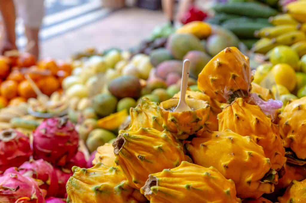 A variety of fruits and vegetables are on display at a market in Madeira, Mercado dos Lavradores Funchal.