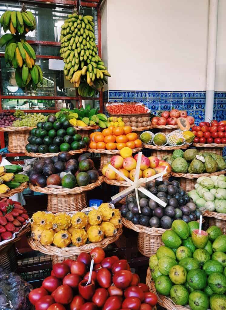 A fruit stand with a lot of different kinds of fruit.