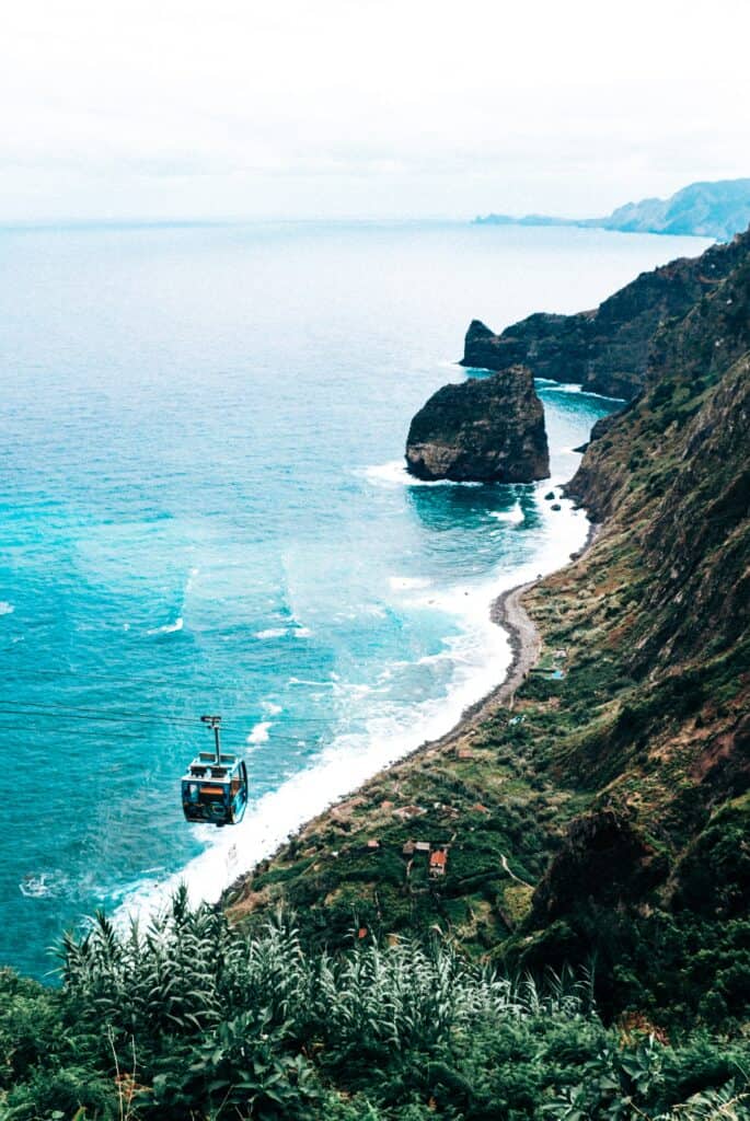 A cable car on a cliff overlooking the ocean on Madeira, Portugal.