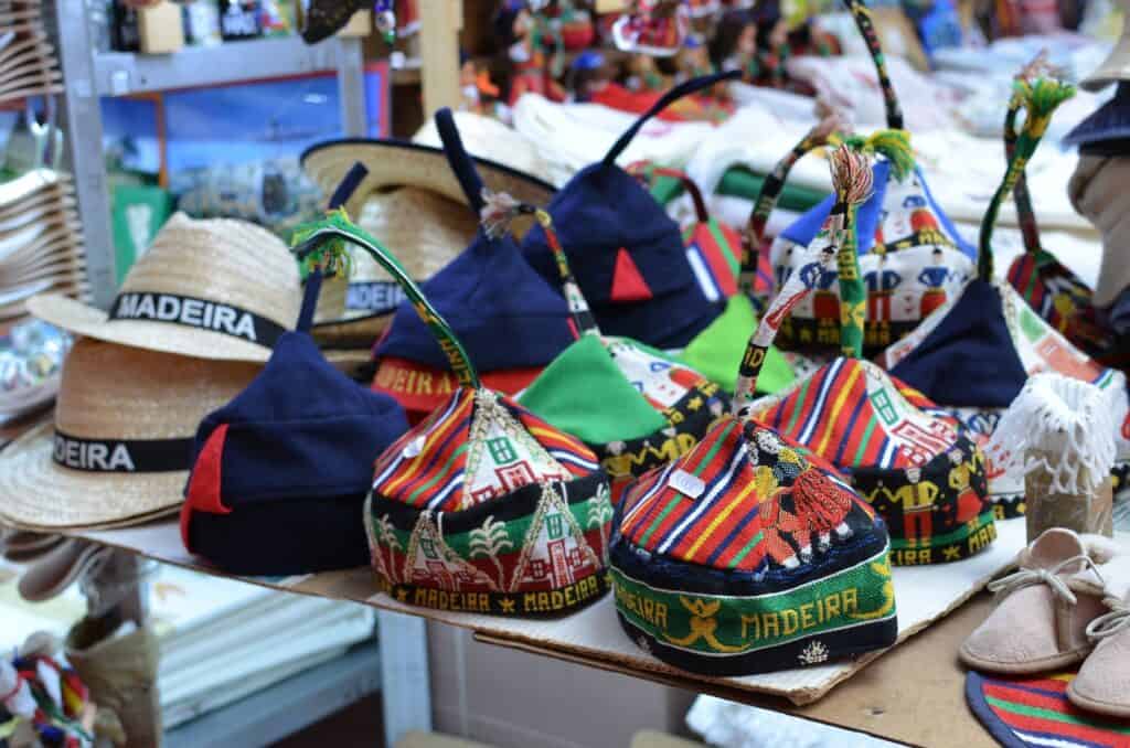 A variety of Madeira souvenirs are on display at a market.