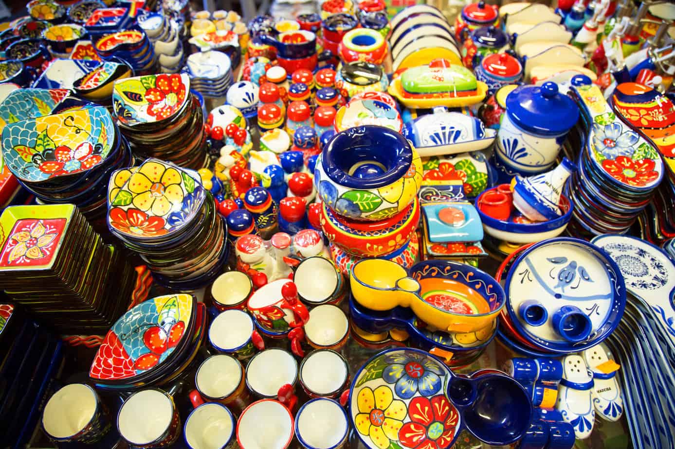 A colorful display of Madeira pottery souvenirs.