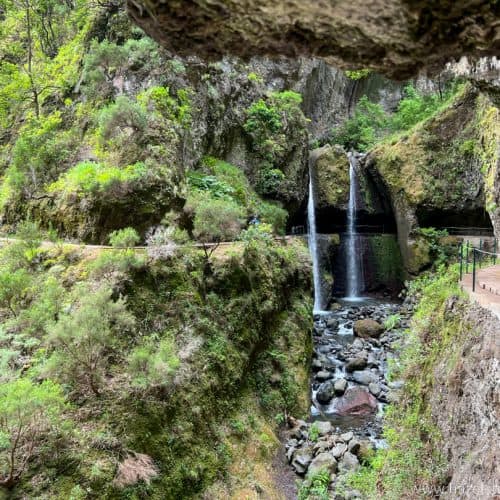A waterfall in the middle of a canyon on the levada do moinho, Madeira.