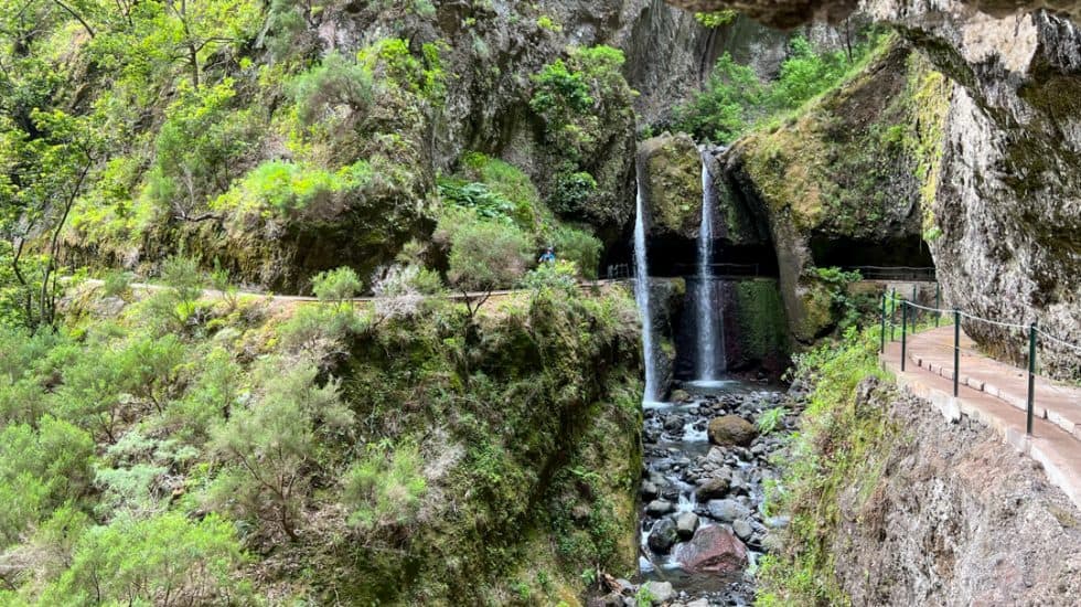 A waterfall in the middle of a canyon on the levada do moinho, Madeira.